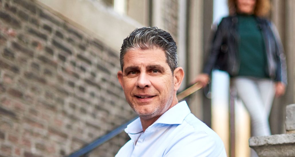 Couple with real-estate agent looking at contract in modern house Couple with real-estate agent looking at contract in modern house