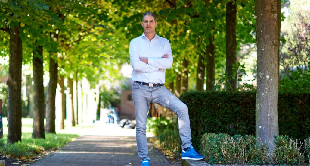 Couple with real-estate agent looking at contract in modern house